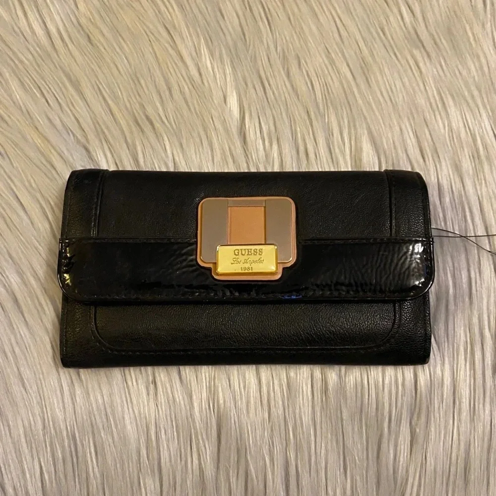 🆕 Guess Black with Tan Accent Buckle on Front Wallet